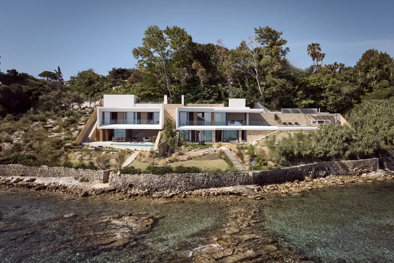 The white beachfront villa above the clear water of the Zakynthos coast