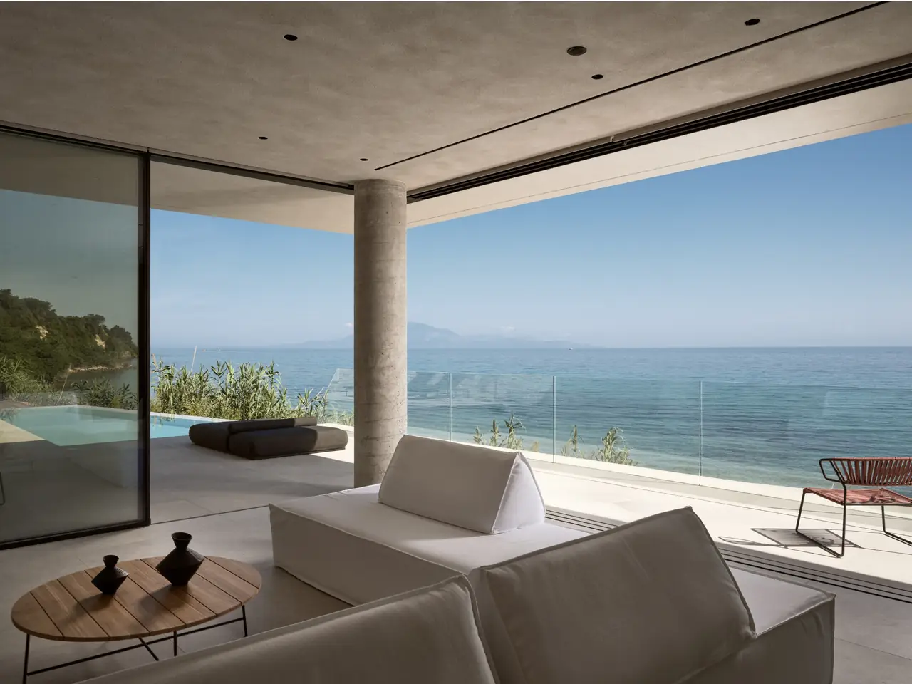 The open-plan lounge opening straight onto the sea-view terrace