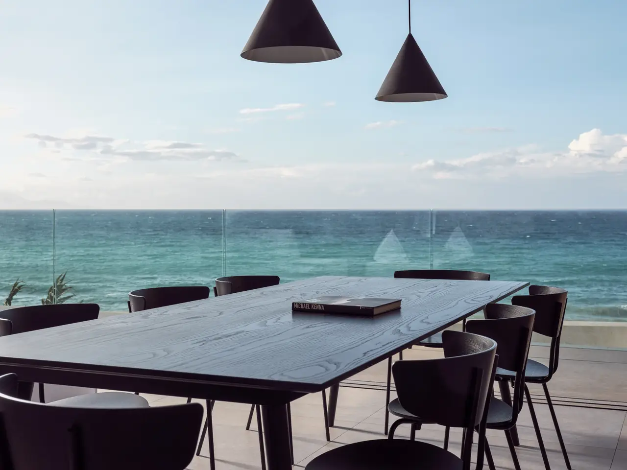 The outdoor dining table with an uninterrupted view of the Ionian Sea