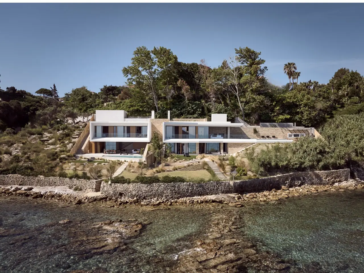 The white beachfront villa above the clear water of the Zakynthos coast