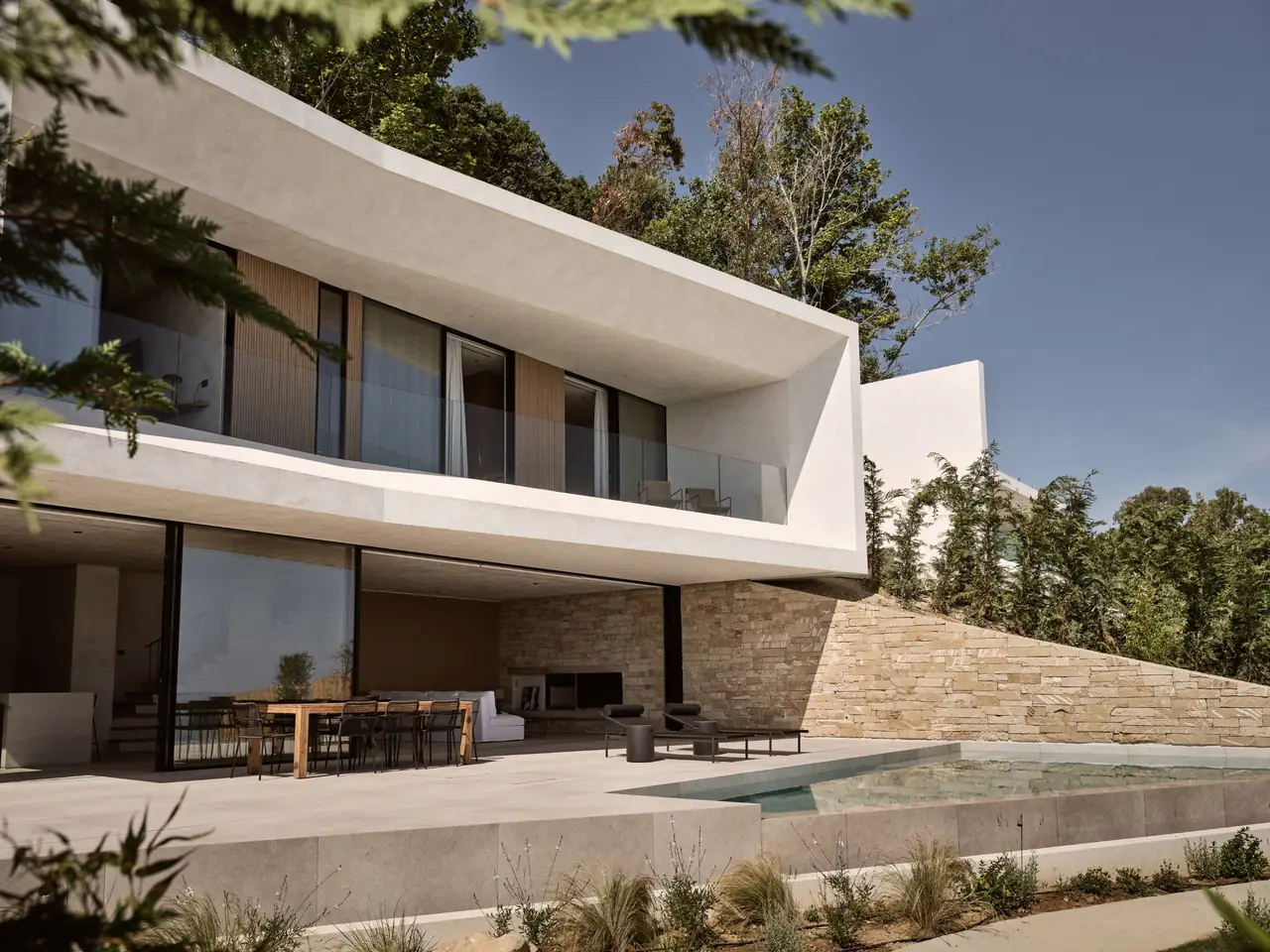 The villa's modern architecture above the pool terrace