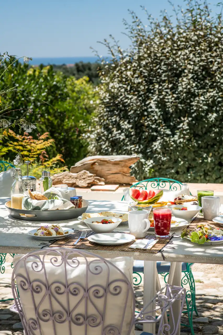 Breakfast laid out on the terrace with a view to the sea