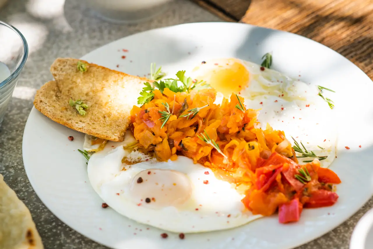 Eggs with roasted vegetables and fresh herbs