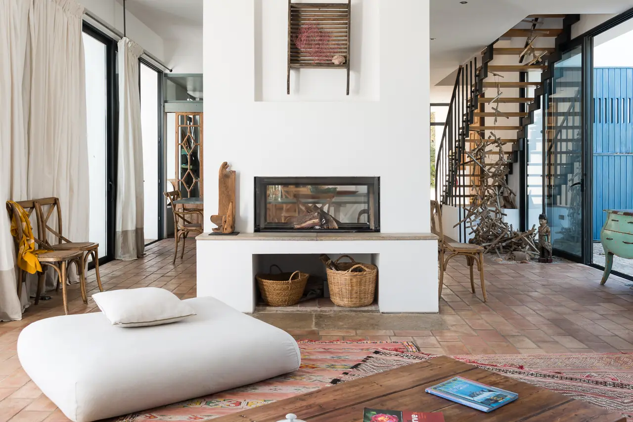 The open living room with a central fireplace