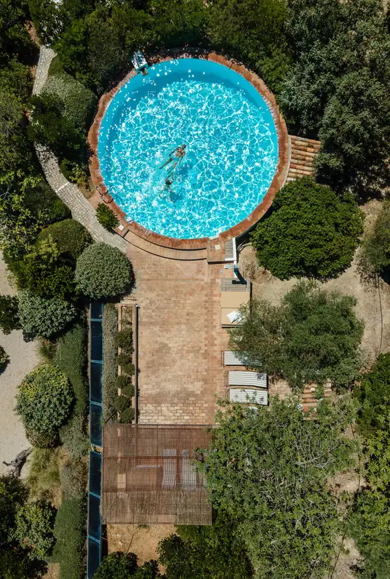 The round pool from above, at the end of a garden path