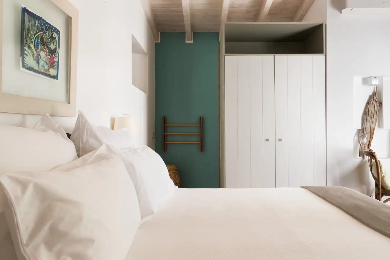A calm single room with crisp white linen